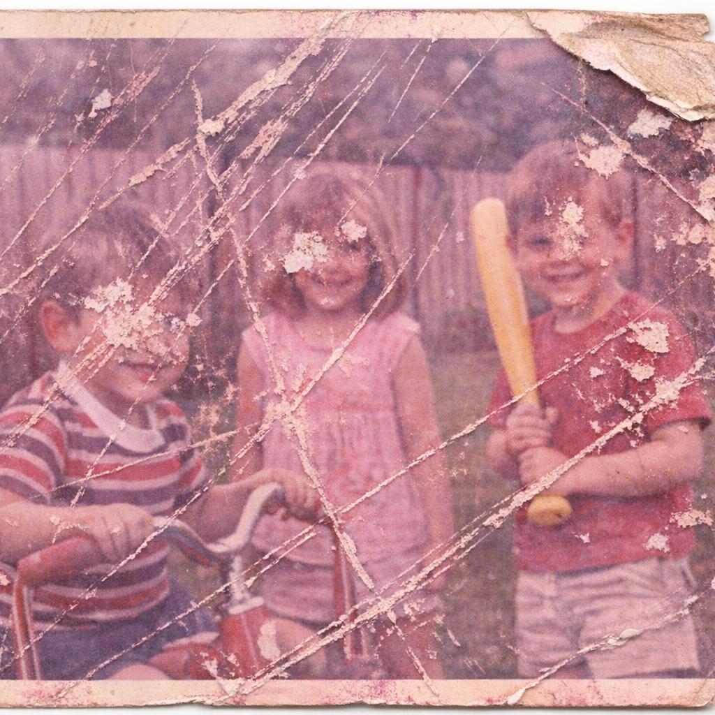 Scratched Family Photo — before AI restoration